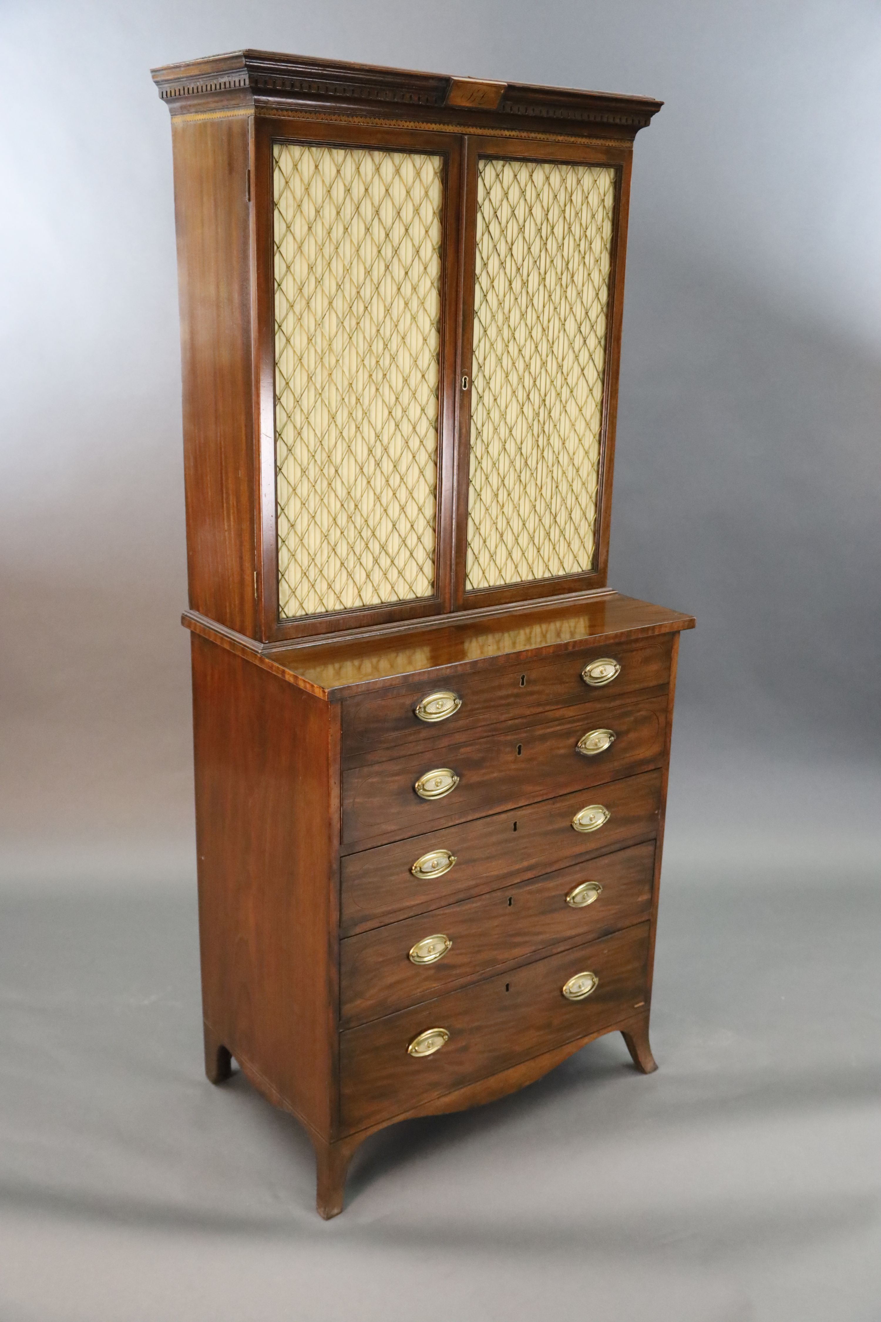 A Regency mahogany secretaire bookcase, W.2ft 9in. D.1ft 8in. H.6ft 1in.